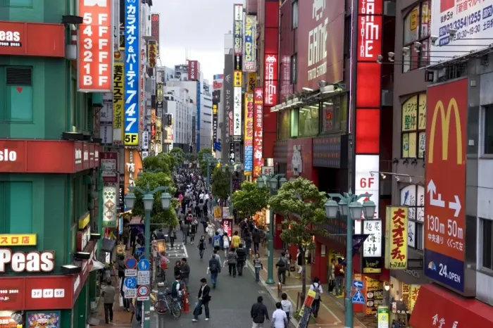 Framed Print : A pedestrian street lined with shops and signboards attracts a crowd in Shinjuku Framed Print : A pedestrian street lined with shops and signboards attracts a crowd in Shinjuku
