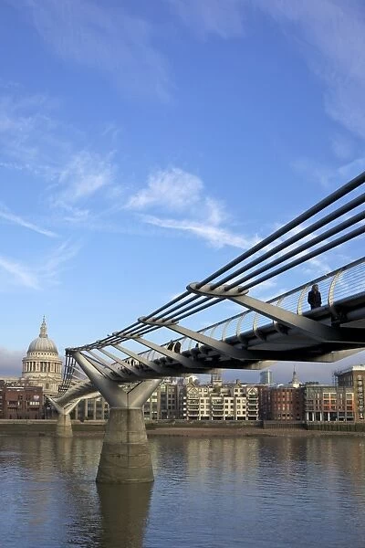 Pedestrians on Millennium Bridge, crossing the River Thames, taken from Bankside looking to St