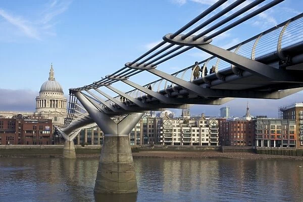 Pedestrians on Millennium Bridge, crossing the River Thames, taken from Bankside looking to St