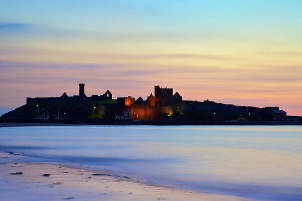 Peel Castle at dusk, St. Patricks Isle, Isle of Man, Europe