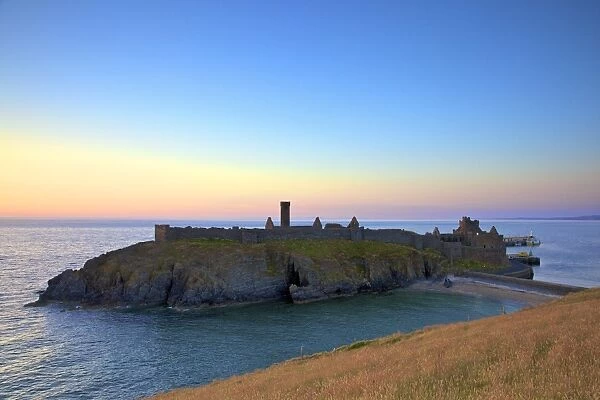 Peel Castle at sunset, St. Patricks Isle, Isle of Man, Europe