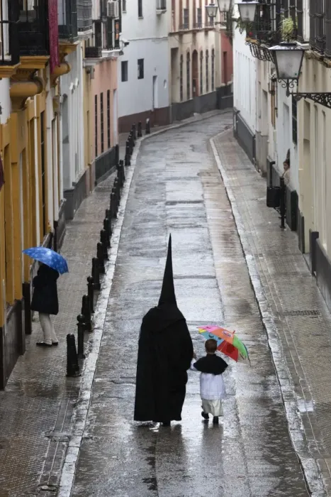 Framed Print : Penitents during Semana Santa (Holy Week) along rainy street, Seville, Andalucia, Spain, Europe Framed Print : Penitents during Semana Santa (Holy Week) along rainy street, Seville, Andalucia, Spain, Europe