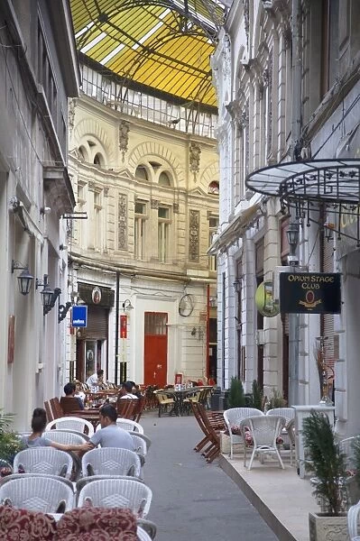 People at cafes in Macca-Villacrosse Passage, Bucharest, Romania, Europe
