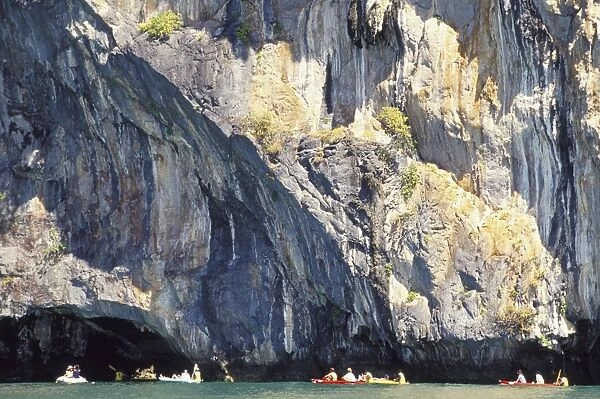 People canoeing near Tham Law (tube cove)