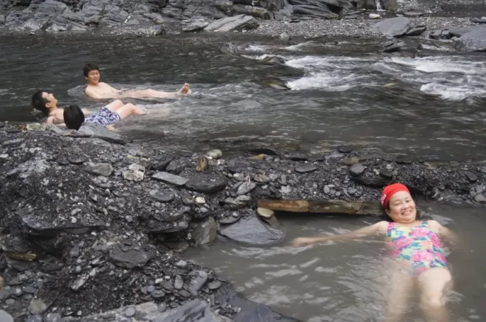 Framed Print : People enjoying natural hot river water of Tona hotspring bath resort Framed Print : People enjoying natural hot river water of Tona hotspring bath resort