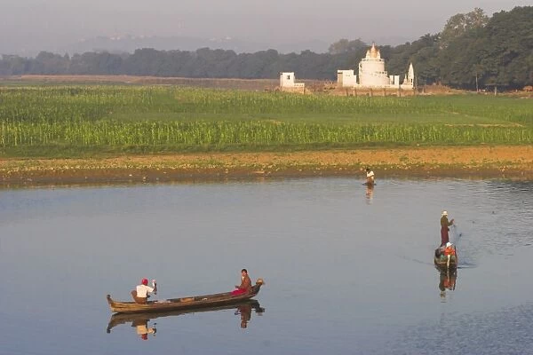 People fishing on Taugthaman Lake near Spiral temple and U Beins Bridge