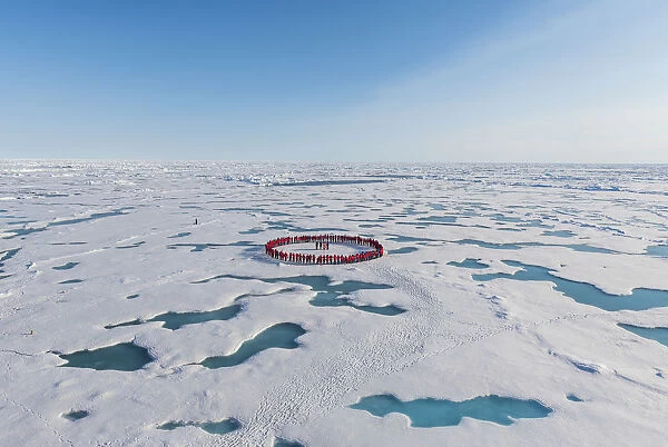 People forming a circle to memorise to have arrived on the North Pole, Arctic
