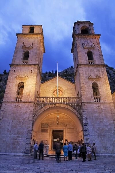People gathered outside St. Tryphons Cathedral in the evening, Kotor
