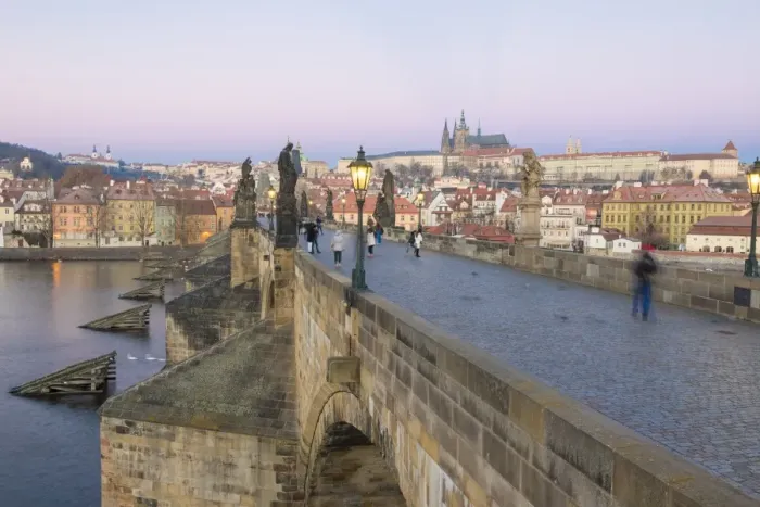 Framed Print : People on the historical Charles Bridge on Vltava River at dawn, UNESCO World Heritage Site Framed Print : People on the historical Charles Bridge on Vltava River at dawn, UNESCO World Heritage Site