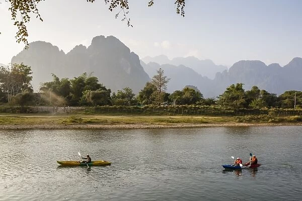 People kayaking on the Nam Song River, Vang Vieng, Laos, Indochina, Southeast Asia, Asia