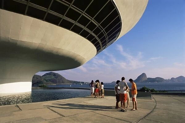People looking at view across bay to Rio from Museo de Arte Contemporanea