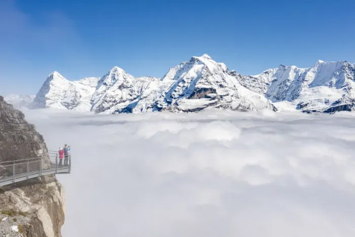 Framed Print : Two people photographing snowcapped Eiger and Monch peaks in fog from elevated walkway Framed Print : Two people photographing snowcapped Eiger and Monch peaks in fog from elevated walkway