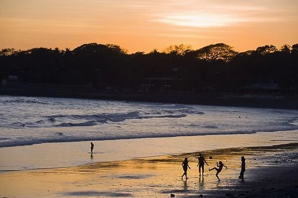 People playing football on the beach at La Libertad, Pacific Coast, El Salvador