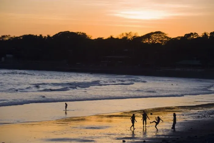 Framed Print : People playing football on the beach at La Libertad, Pacific Coast, El Salvador