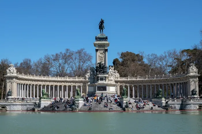 Framed Print : People relaxing in front of the Monument to Alfonso XII and boating lake in Retiro Park in the heart of the capital city of Madrid, Spain Framed Print : People relaxing in front of the Monument to Alfonso XII and boating lake in Retiro Park in the heart of the capital city of Madrid, Spain