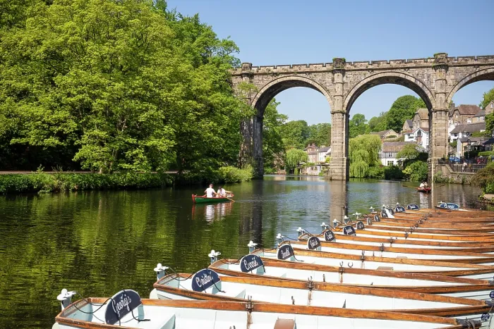 Framed Print : People rowing past boats for hire in front of the Railway Viaduct over the river Nidd in Knaresborogh, Yorkshire, United Kingdom Framed Print : People rowing past boats for hire in front of the Railway Viaduct over the river Nidd in Knaresborogh, Yorkshire, United Kingdom