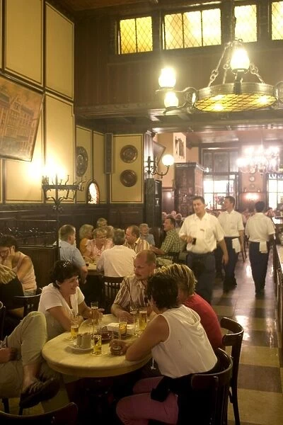 People sitting inside the Fruh am Dom beer hall in the Altstadt