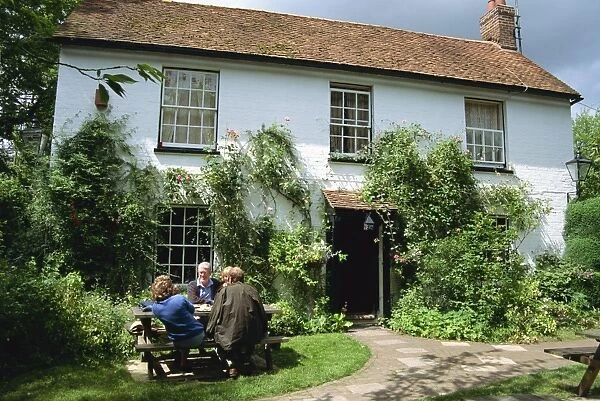 People sitting outside the Bush Inn, Ovington, Hampshire, England, United Kingdom, Europe