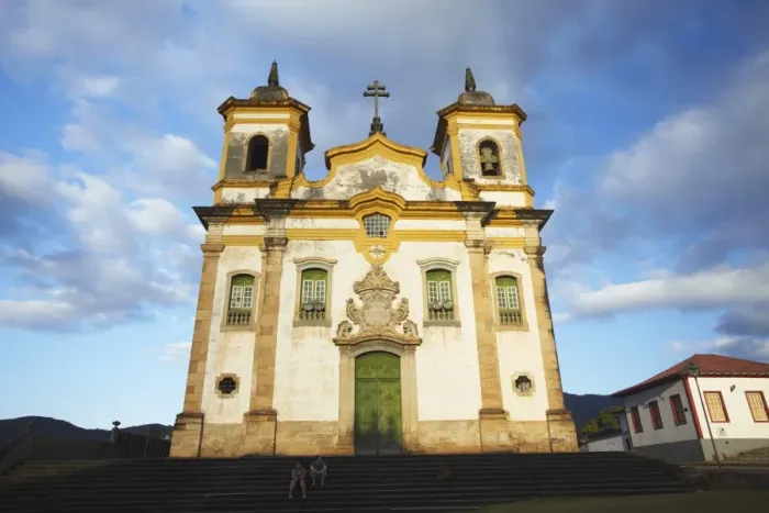 Framed Print : People sitting outside Sao Francisco of Assis Church in Praca Minas Gerais, Mariana, Minas Gerais, Brazil, South America Framed Print : People sitting outside Sao Francisco of Assis Church in Praca Minas Gerais, Mariana, Minas Gerais, Brazil, South America
