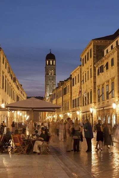 People strolling and cafes, Placa lit up at dusk, Dubrovnik, Croatia, Europe