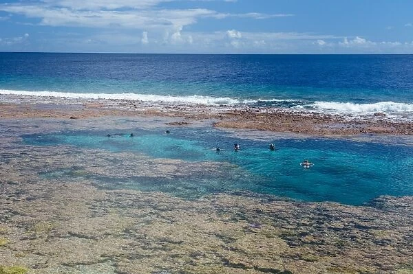 People swimming in the amazing Limu low tide pools, Niue, South Pacific, Pacific