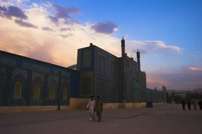 Framed Print : People walk at sunset past the Shrine of Hazrat Ali, who was assassinated in 661 Framed Print : People walk at sunset past the Shrine of Hazrat Ali, who was assassinated in 661