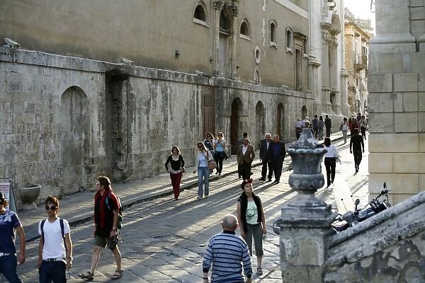 People walking by the main street in Noto, Sicily, Italy, Europe