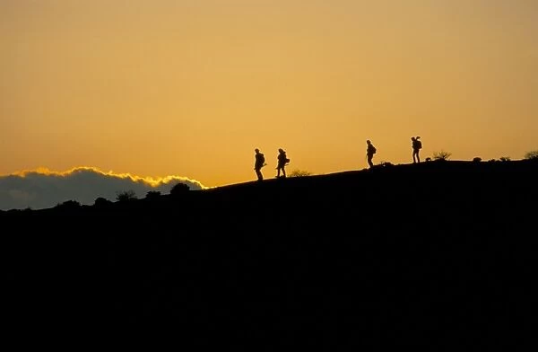 People walking at sunset on top of White House Cliffs