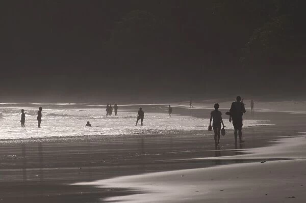 People walking along the wonderful Elephanta Beach in the dusk, Havelock Island