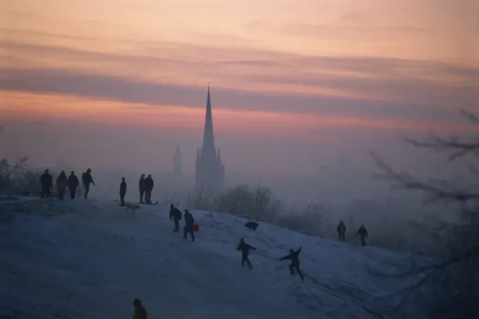 Framed Print : People in a winter landscape with snow on the ground and Norwich Cathedral in the background Framed Print : People in a winter landscape with snow on the ground and Norwich Cathedral in the background