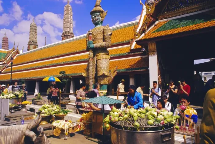Framed Print : People worshipping and offering flowers in the Wat Phra Kaew complex Framed Print : People worshipping and offering flowers in the Wat Phra Kaew complex
