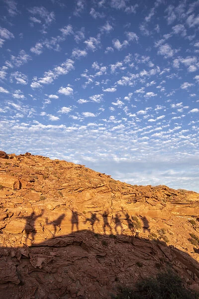 Peoples shadows on wind formed sandstone formations at Los Gatos, Baja California Sur