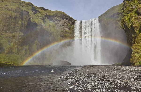 A permanent rainbow in waterfall spray, Skogafoss Falls, near Vik, southern Iceland