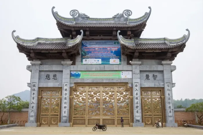 Framed Print : A person looking up at Bai Dinh Temple (Chua Bai Dinh) gate, Gia Vien District, Ninh Binh Province Framed Print : A person looking up at Bai Dinh Temple (Chua Bai Dinh) gate, Gia Vien District, Ninh Binh Province