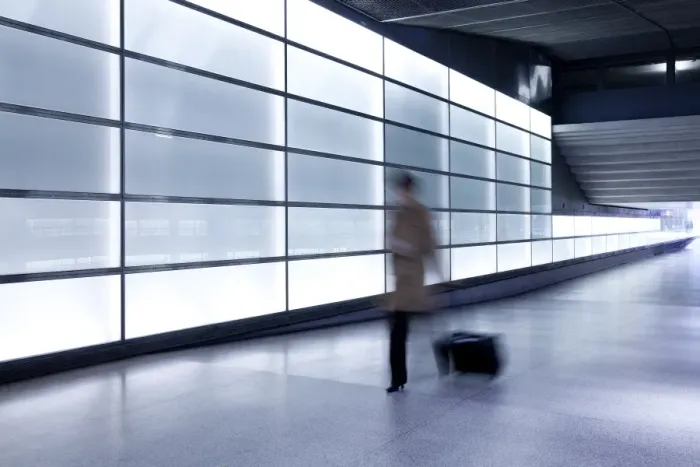 Framed Print : Person walking with motion blur in passageway at modern train station, Berlin Framed Print : Person walking with motion blur in passageway at modern train station, Berlin