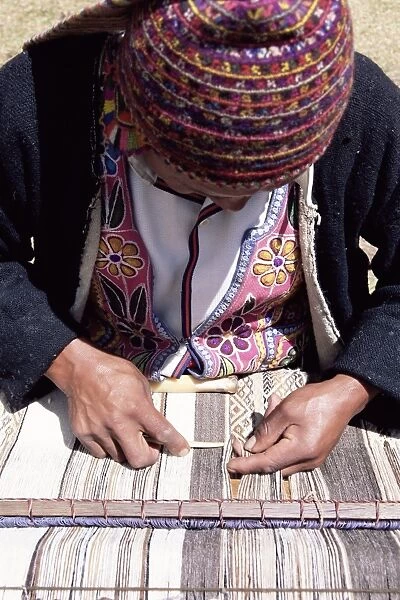 A Peruvian man weaving
