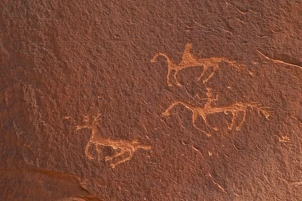 Petroglyphs of riders on horseback hunting an antelope, Canyon de Chelly National Monument, Arizona, United States of America, North America