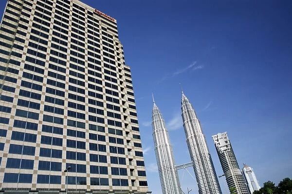 Petronas twin towers and business building on left