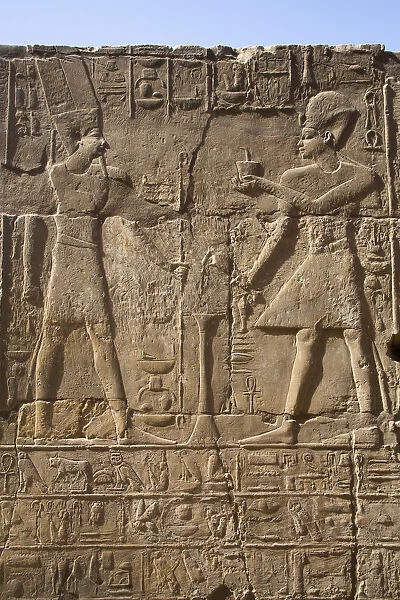 Pharaoh on right, God Amun on the left, Bas Relief, Luxor Temple