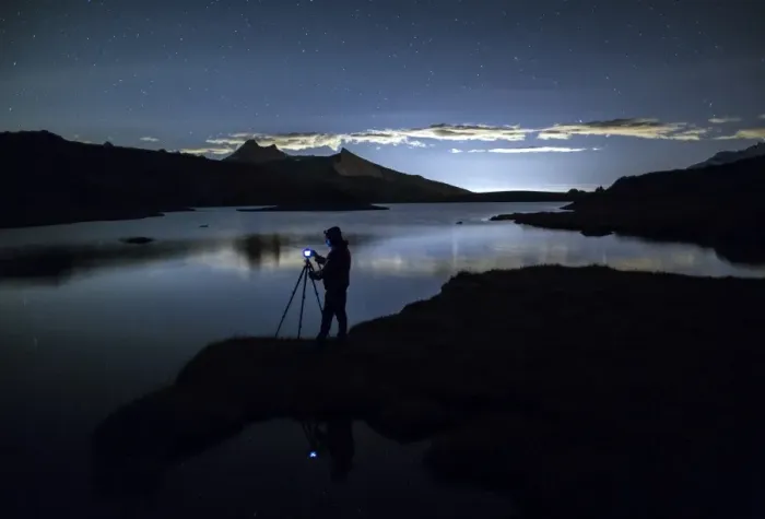 Framed Print : Photographer admires reflection on Rossett Lake at night, Gran Paradiso National Park Framed Print : Photographer admires reflection on Rossett Lake at night, Gran Paradiso National Park