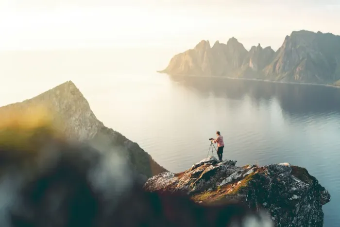 Framed Print : Photographer with tripod on Husfjellet mountain watching sunset on sharp peaks of mount Framed Print : Photographer with tripod on Husfjellet mountain watching sunset on sharp peaks of mount