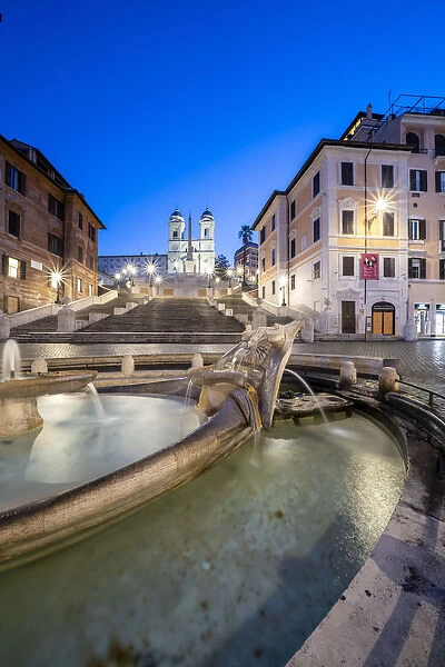 Piazza di Spagna (Spanish Steps), Barcaccia fountain and Trinita dei Monti at dusk, Rome