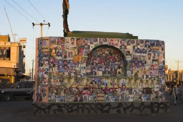 Framed Print : Pictures of election candidates stuck on building in midddle of street Framed Print : Pictures of election candidates stuck on building in midddle of street