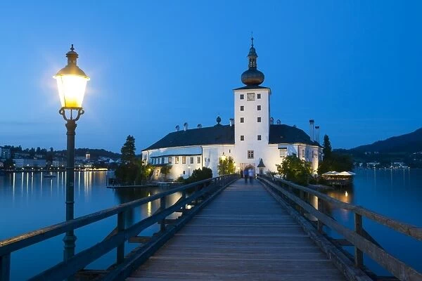 Picturesque Schloss Ort illuminated at dusk, Lake Traunsee, Gmunden, Salzkammergut, Upper Austria, Austria, Europe