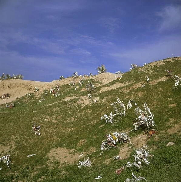 Pieces of cloth tied on hilltop by women to ask for a son, Nyrato, Uzbekistan
