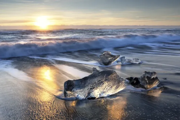 Framed Print : Pieces of glacier ice washed up on black volcanic sand beach at sunrise, near Jokulsarlon Framed Print : Pieces of glacier ice washed up on black volcanic sand beach at sunrise, near Jokulsarlon