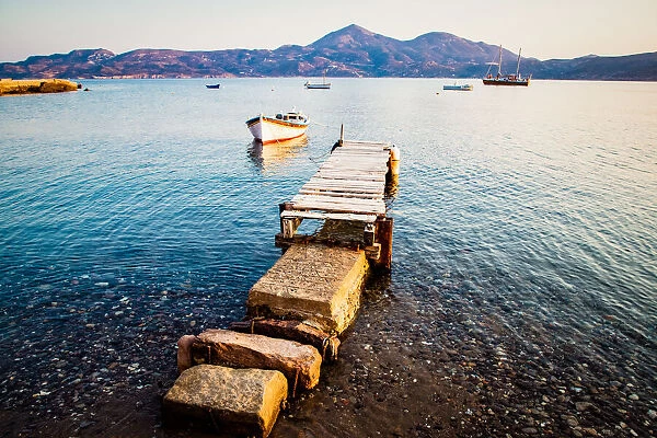 Pier and fishing boat, Milos, Cyclades, Greek Islands, Greece, Europe