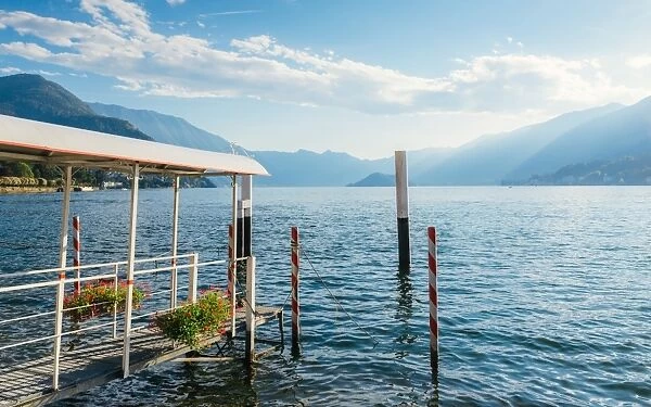 Pier overlooking beautiful Lake Como in summer, Lombardy, Italian Lakes, Italy, Europe