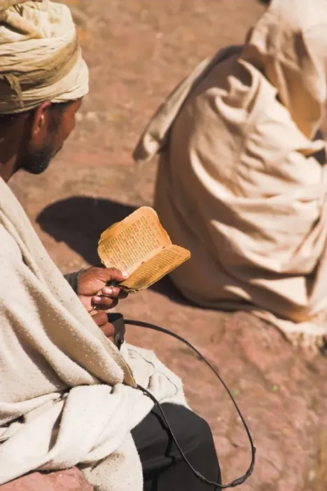 Framed Print : Pilgrim reads Holy Bible in Bet Maryam (St. Mary s) courtyard, Lalibela Framed Print : Pilgrim reads Holy Bible in Bet Maryam (St. Mary s) courtyard, Lalibela