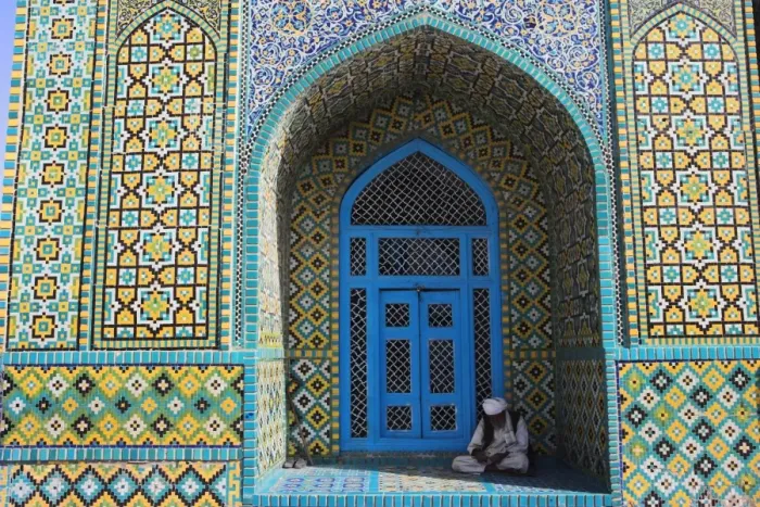 Framed Print : Pilgrim sits in a niche at the Shrine of Hazrat Ali, who was assassinated in 661 Framed Print : Pilgrim sits in a niche at the Shrine of Hazrat Ali, who was assassinated in 661